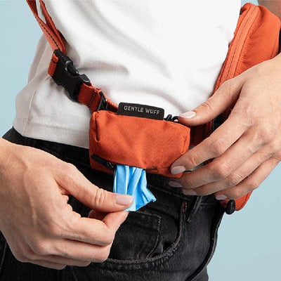 Person using a Gentle Wuff dog training device with a blue cloth.